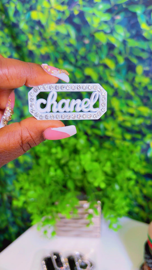 White metal charm with rhinestones