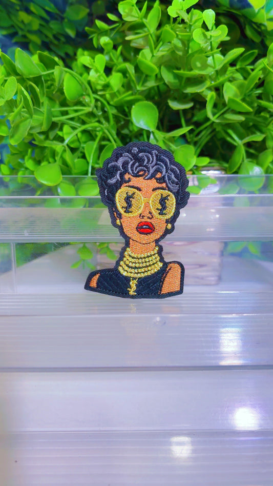 Black and gold iron on lady patch