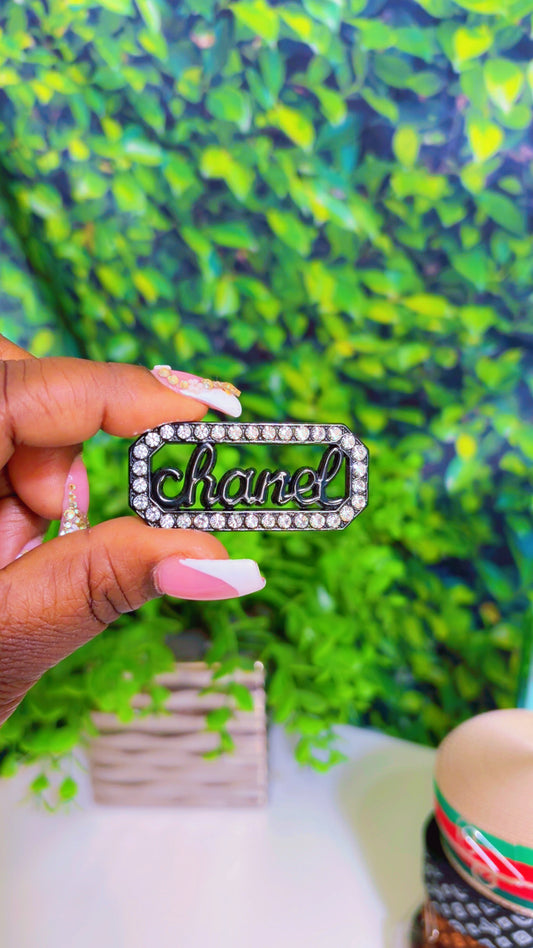 Black metal charm with rhinestones