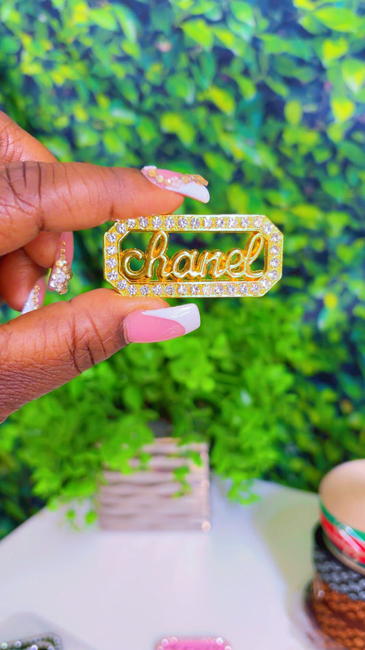 Gold metal charm with rhinestones